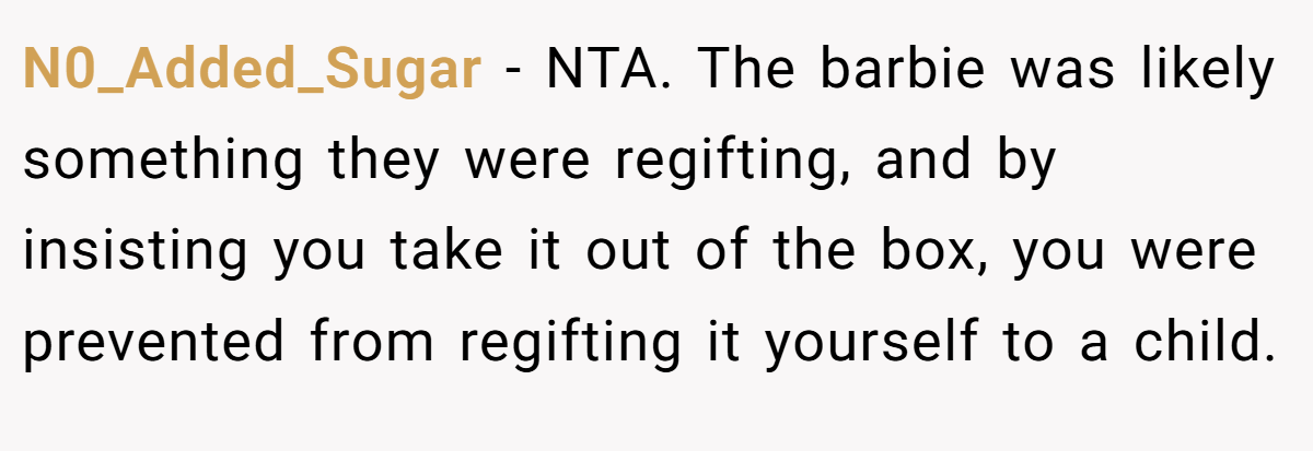 N0_Added_Sugar − NTA. The barbie was likely something they were regifting, and by insisting you take it out of the box, you were prevented from regifting it yourself to a child.