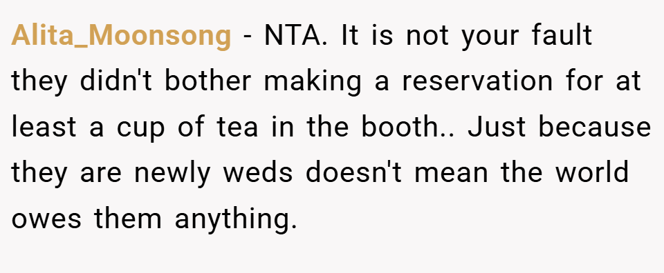 Alita_Moonsong − NTA. It is not your fault they didn't bother making a reservation for at least a cup of tea in the booth.. Just because they are newly weds doesn't mean the world owes them anything.