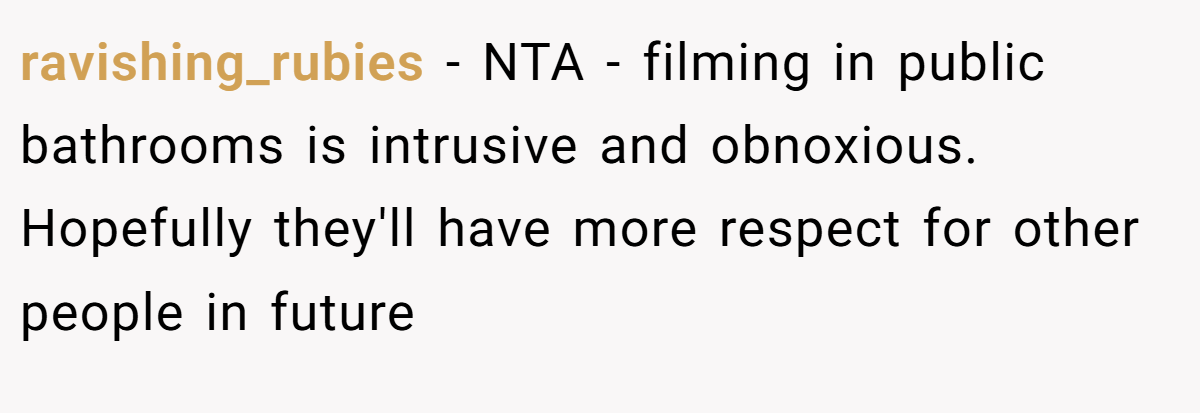 ravishing_rubies − NTA - filming in public bathrooms is intrusive and obnoxious. Hopefully they'll have more respect for other people in future