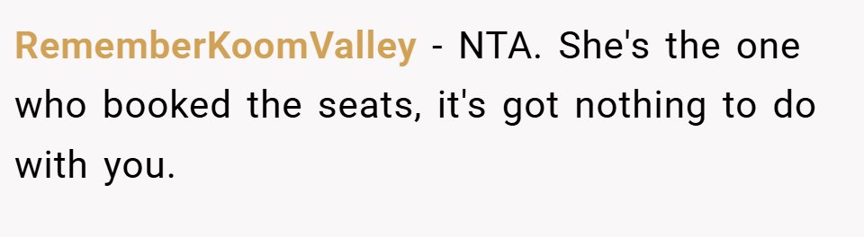 RememberKoomValley − NTA. She's the one who booked the seats, it's got nothing to do with you.