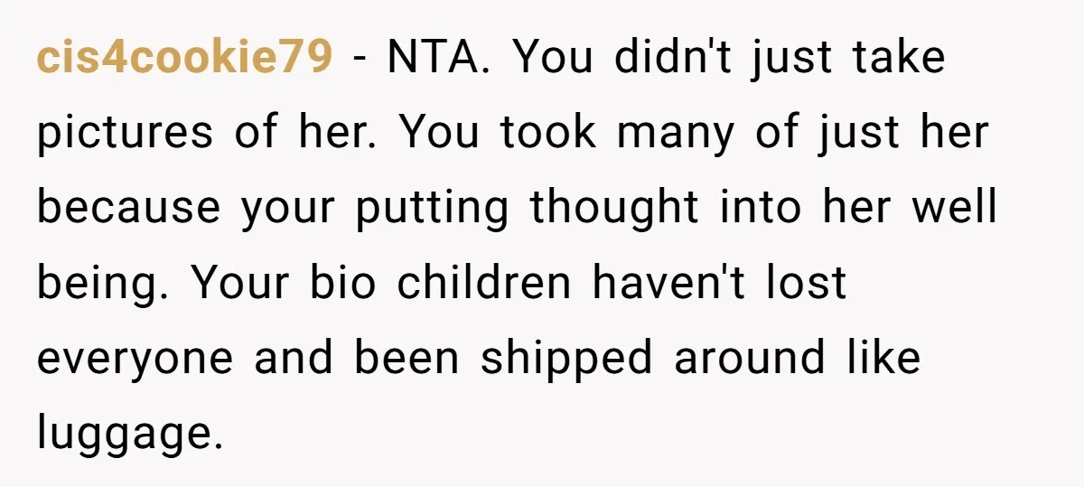 cis4cookie79 − NTA. You didn't just take pictures of her. You took many of just her because your putting thought into her well being. Your bio children haven't lost everyone...
