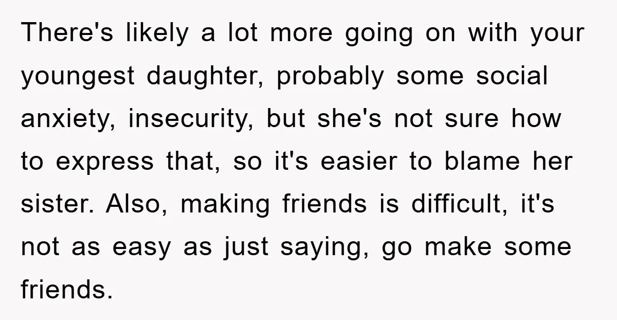There's likely a lot more going on with your youngest daughter, probably some social anxiety, insecurity, but she's not sure how to express that, so it's easier to blame her...