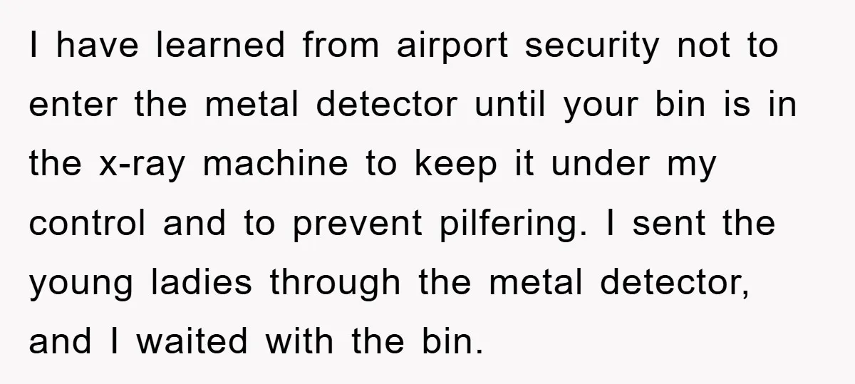 I have learned from airport security not to enter the metal detector until your bin is in the x-ray machine to keep it under my control and to prevent pilfering....