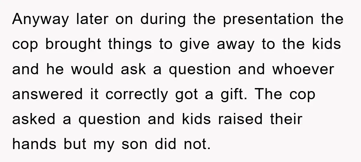 Anyway later on during the presentation the cop brought things to give away to the kids and he would ask a question and whoever answered it correctly got a gift....