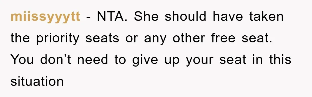 miissyyytt − NTA. She should have taken the priority seats or any other free seat. You don’t need to give up your seat in this situation