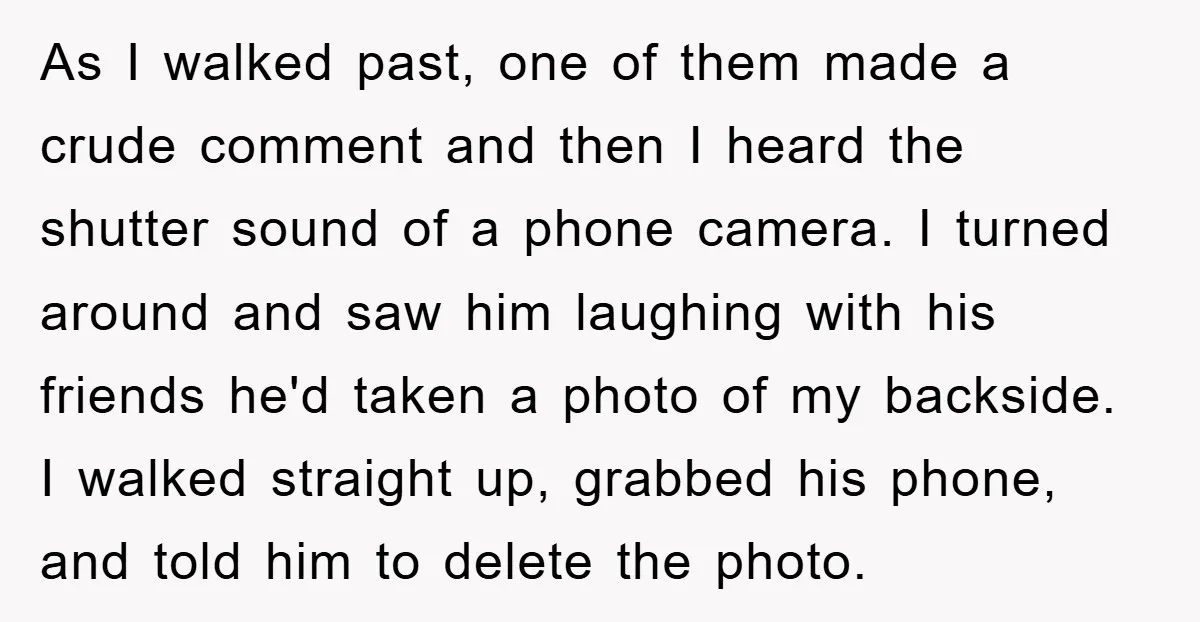 As I walked past, one of them made a crude comment and then I heard the shutter sound of a phone camera. I turned around and saw him laughing with...