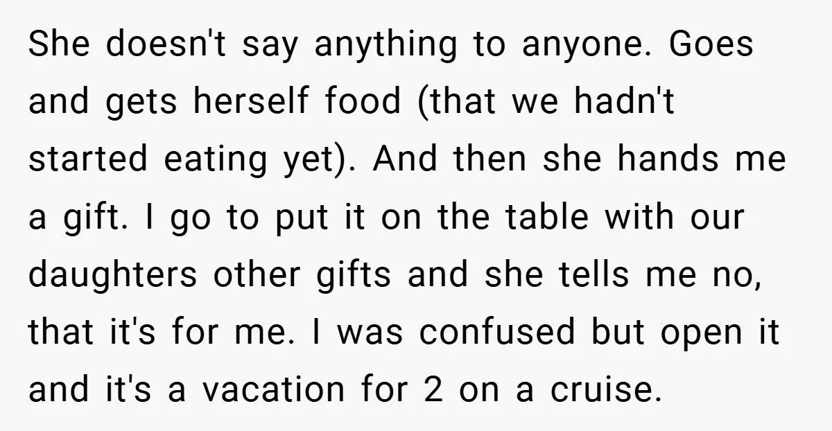 She doesn't say anything to anyone. Goes and gets herself food (that we hadn't started eating yet). And then she hands me a gift. I go to put it on...
