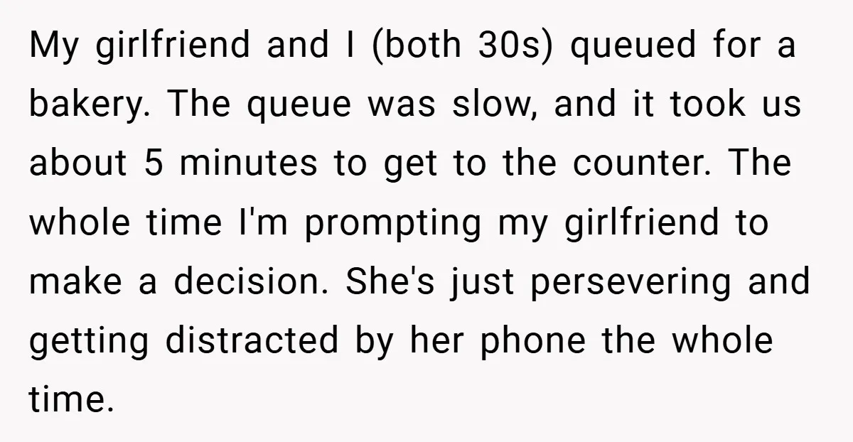 My girlfriend and I (both 30s) queued for a bakery. The queue was slow, and it took us about 5 minutes to get to the counter. The whole time I'm...