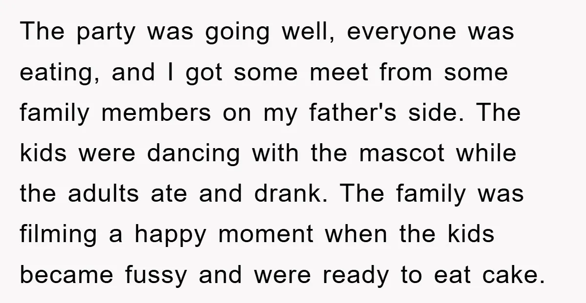 The party was going well, everyone was eating, and I got some meet from some family members on my father's side. The kids were dancing with the mascot while the...