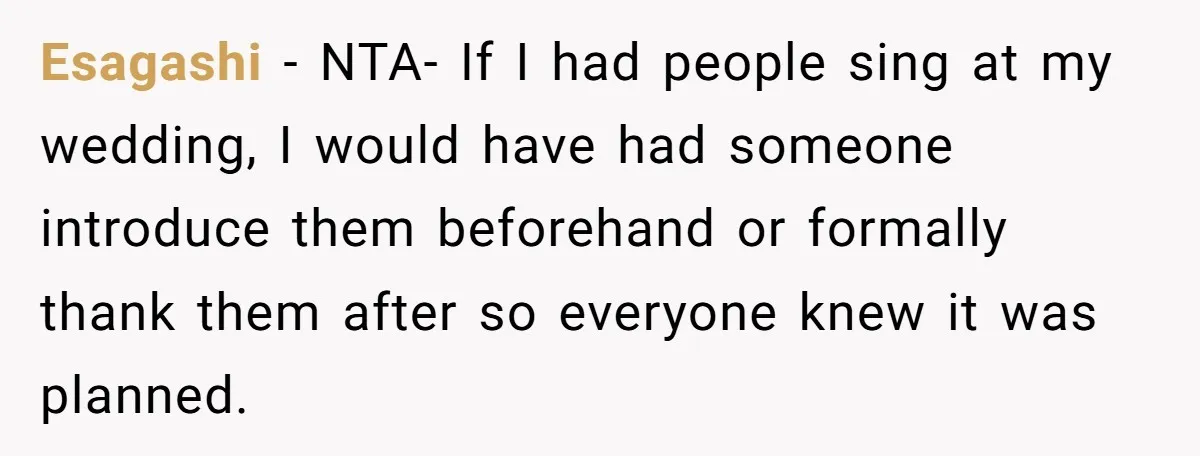 Esagashi − NTA- If I had people sing at my wedding, I would have had someone introduce them beforehand or formally thank them after so everyone knew it was planned.