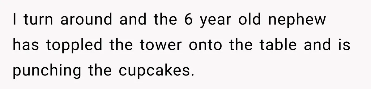 I turn around and the 6 year old nephew has toppled the tower onto the table and is punching the cupcakes.