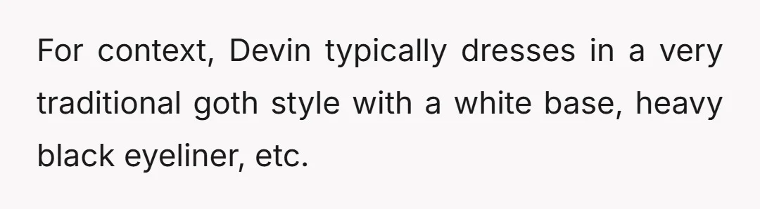 For context, Devin typically dresses in a very traditional goth style with a white base, heavy black eyeliner, etc.