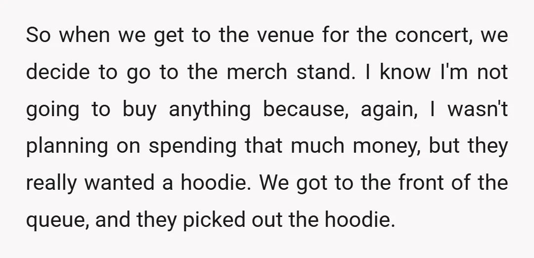 So when we get to the venue for the concert, we decide to go to the merch stand. I know I'm not going to buy anything because, again, I wasn't...