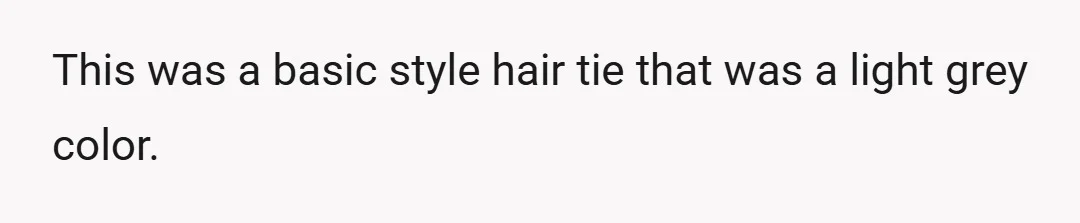 This was a basic style hair tie that was a light grey color.