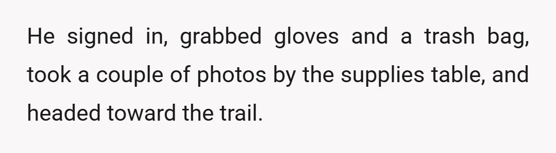 He signed in, grabbed gloves and a trash bag, took a couple of photos by the supplies table, and headed toward the trail.